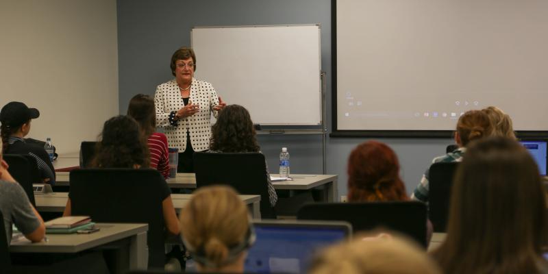 Alumni speaking to students