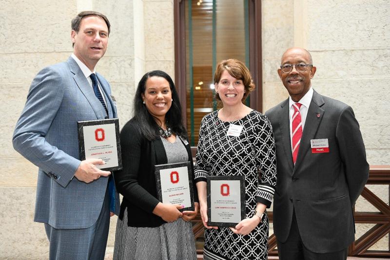 Alisha Nelson poses with Ohio State President Michael Drake and Distinguished Service Award Winners