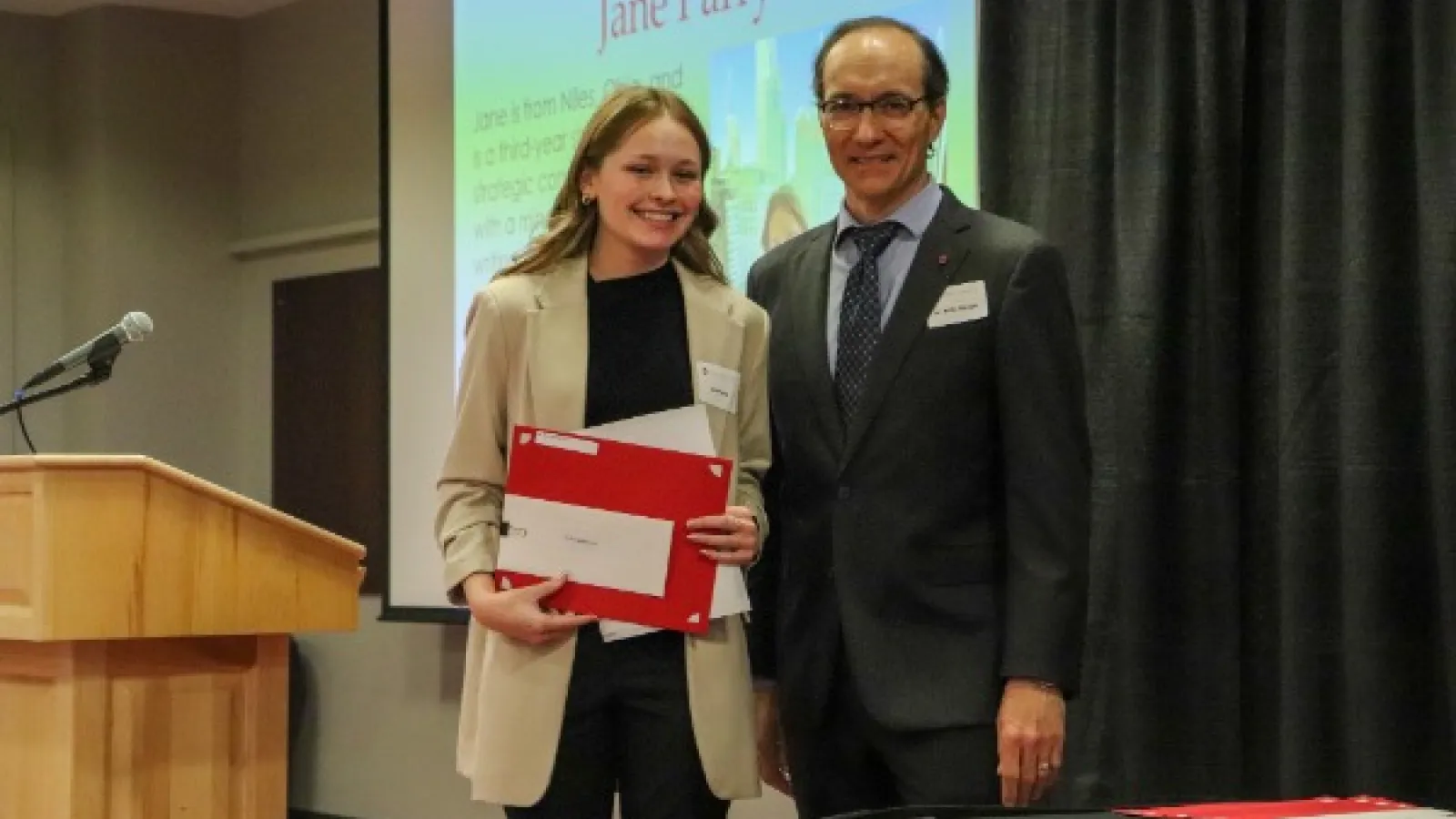 Jane Parry accepts award from Dr. Kelly Garrett 