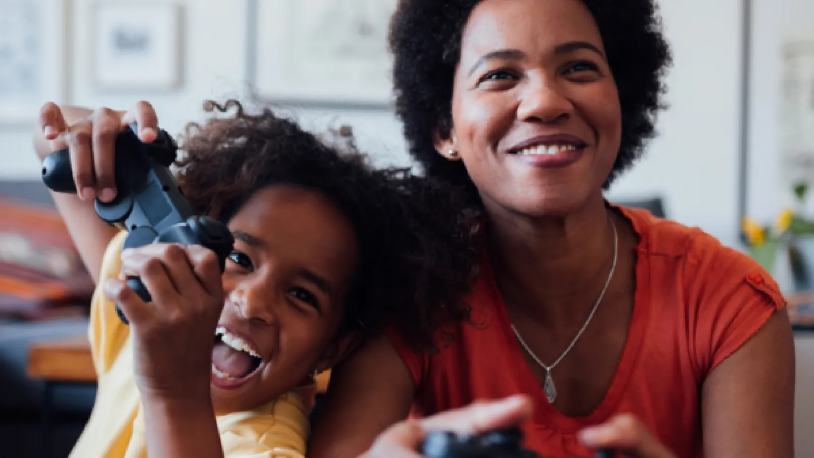 Mother and son playing video games