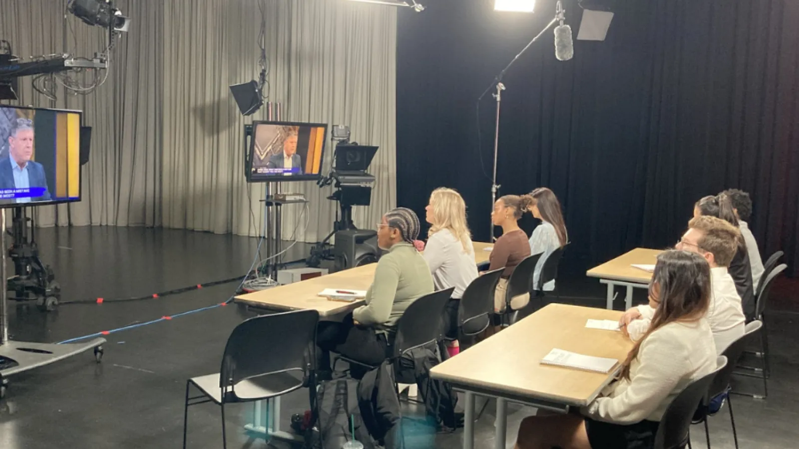 Students pictured participating in simulcast from the back.