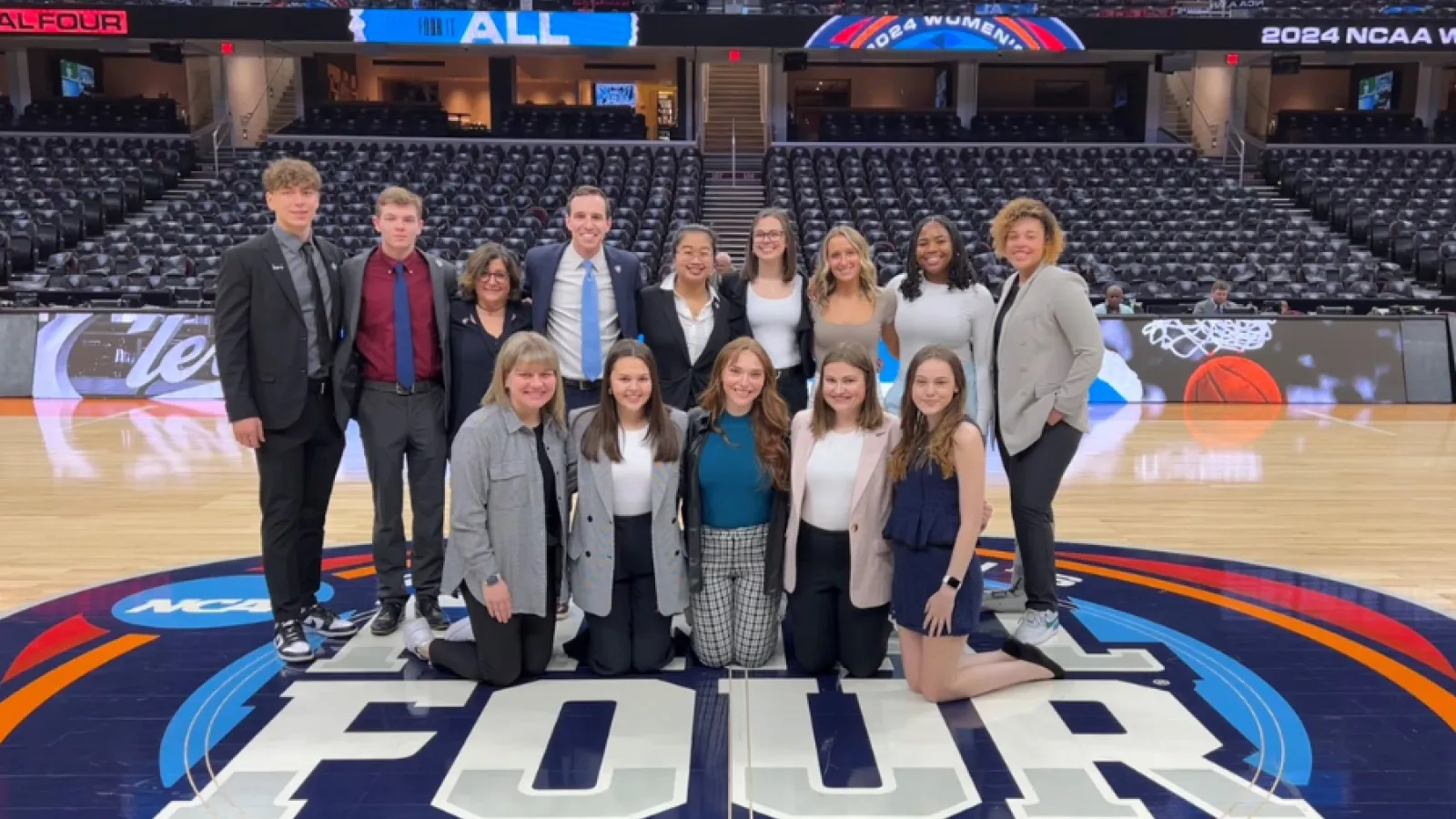 Group photo of Nicole Kraft, Aaron Klein and SSI students at the NCAA Women's Final Four.