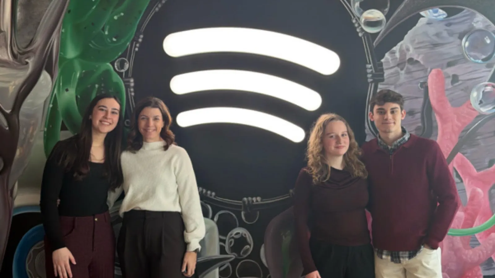 Students infront of spotify