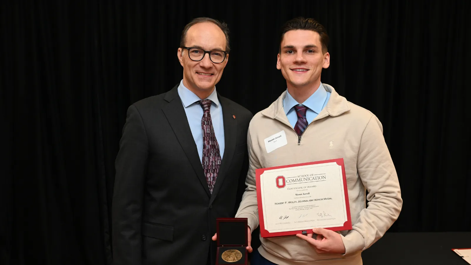 Student and teacher at banquet
