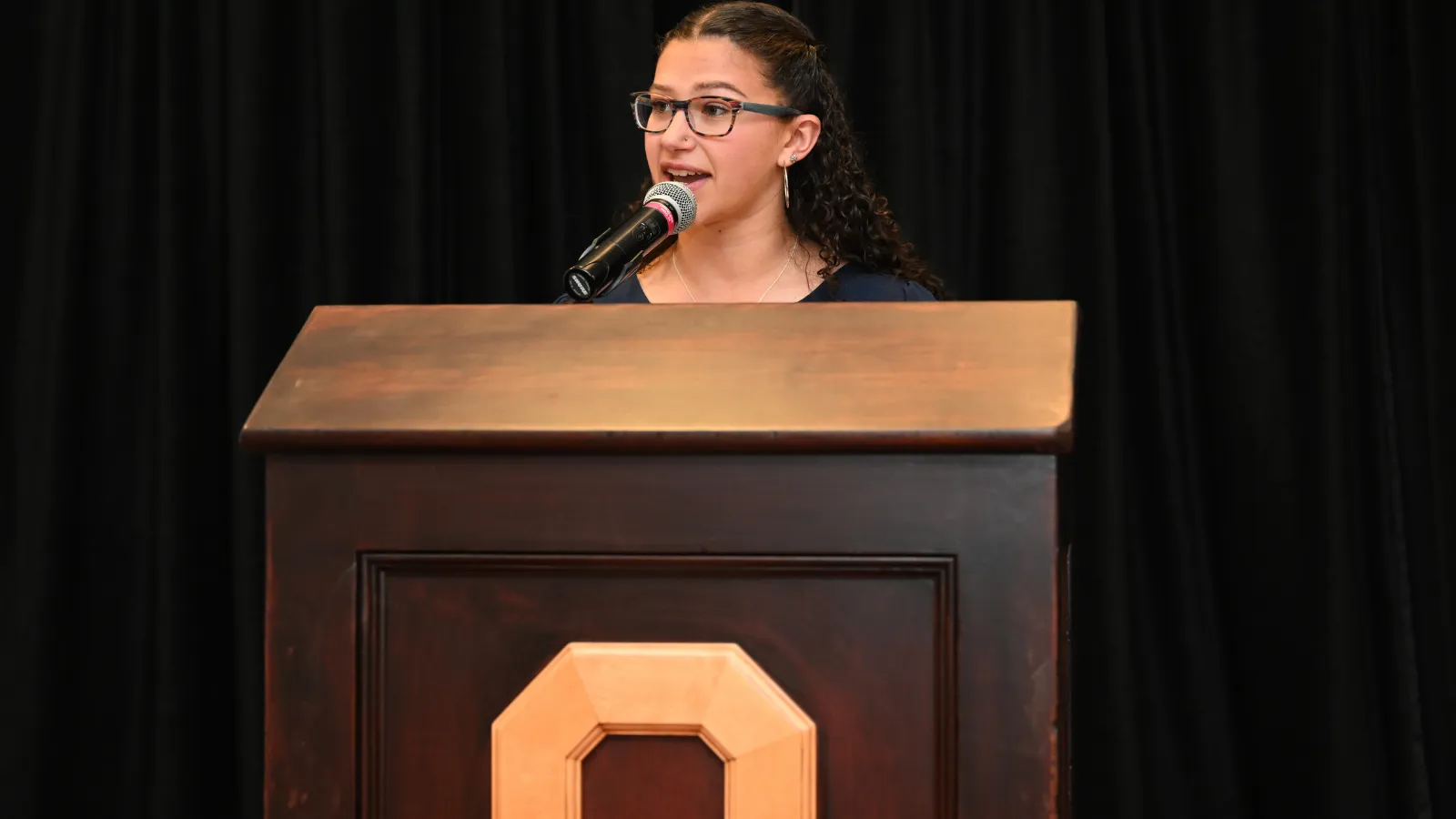 Student giving speech at banquet 