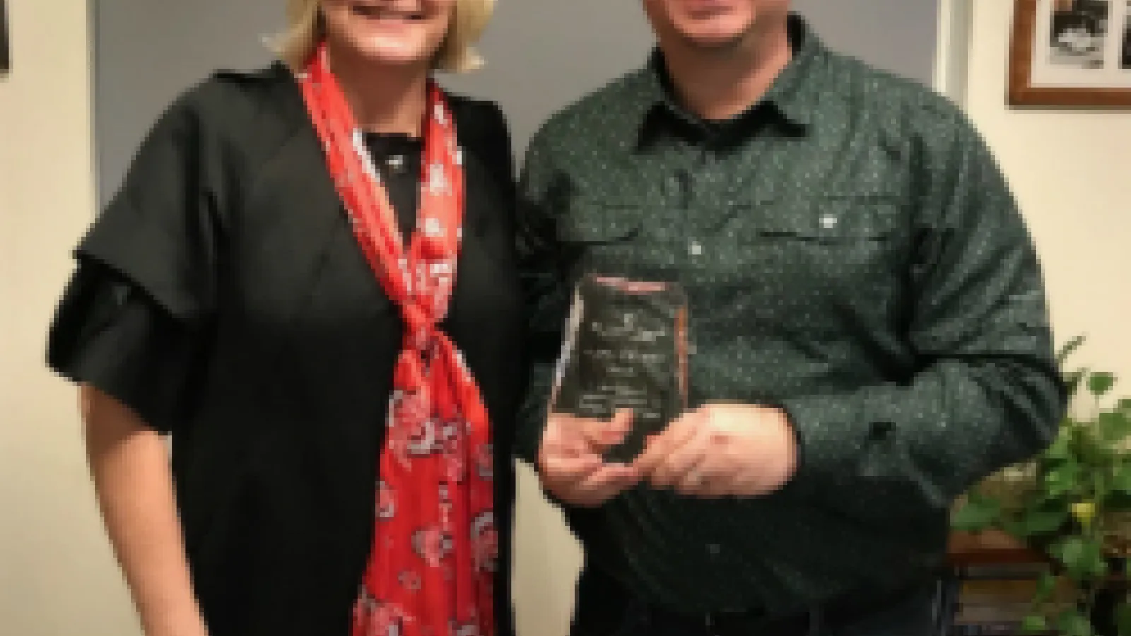 Aaron Smith with the Staff Excellence Award 
