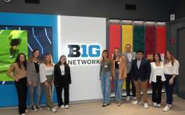 PRSSA students pose for photo by a Big 10 Network sign.