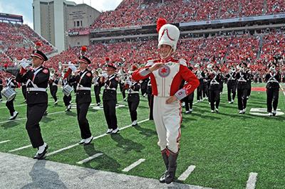 Drum major Konner Barr leads the band on field