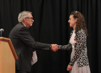 Brennan giving award Dr. Brennan giving award