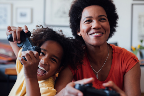 Mother and son playing video games