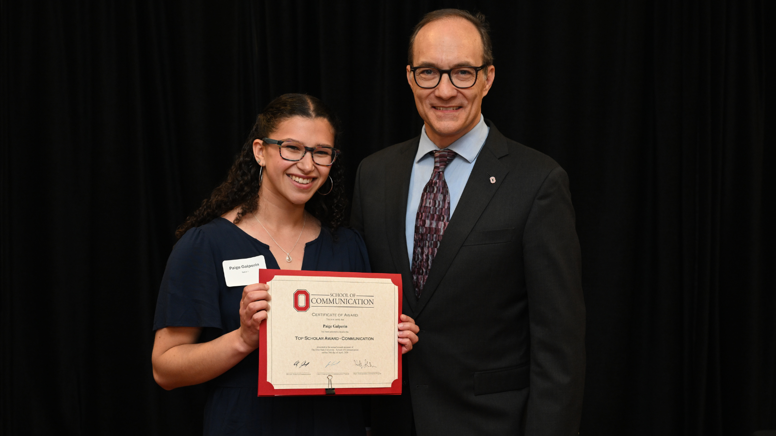 Student and teacher at banquet