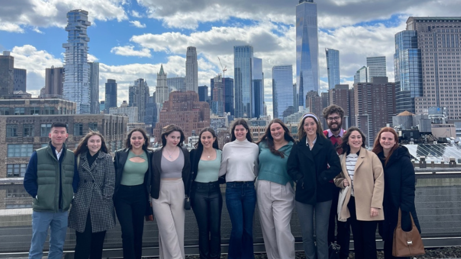 PRSSA students pose for photo on rooftop balcony at Edelman.