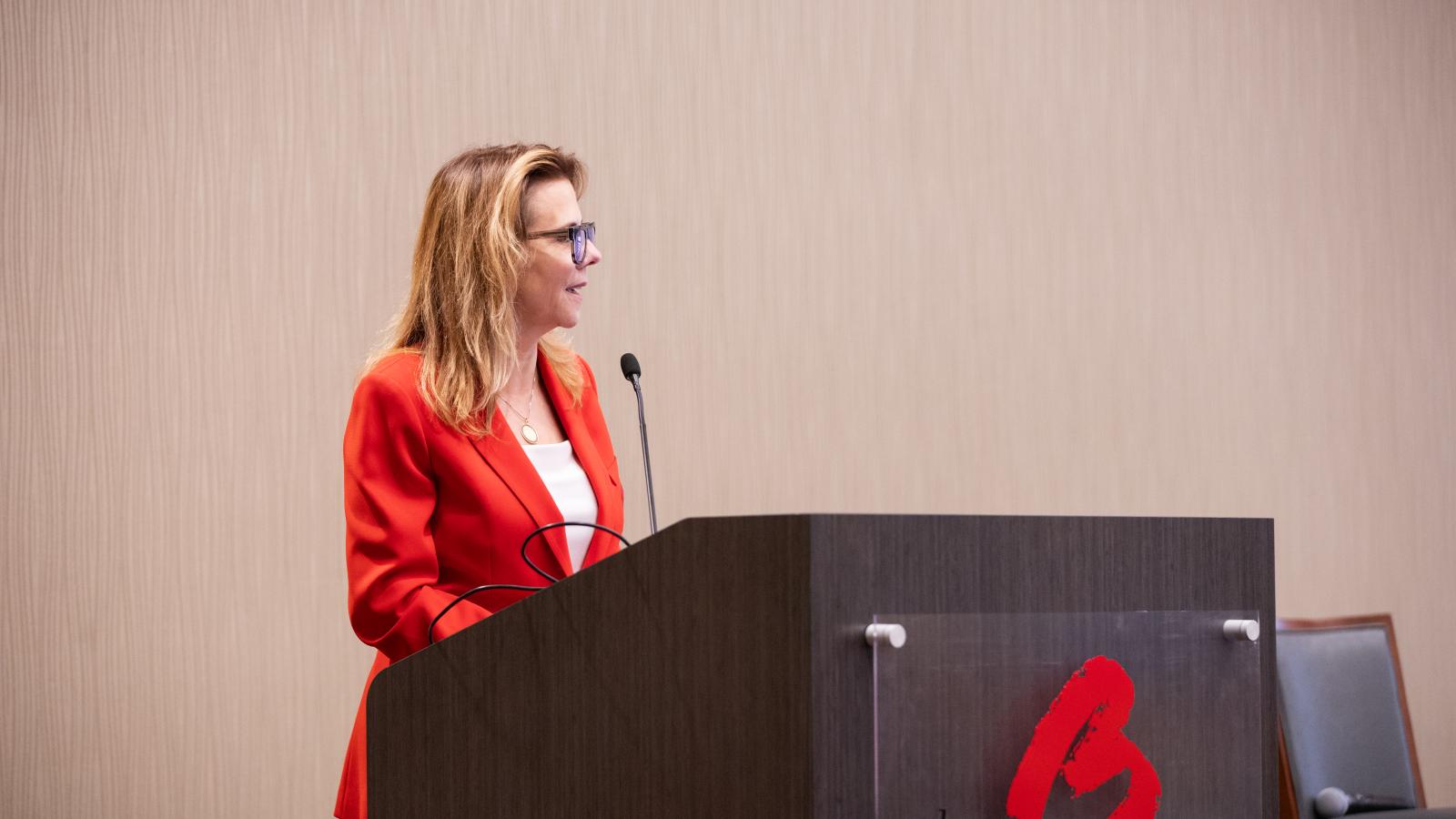 Adrienne Roark speaking at alumni reunion 