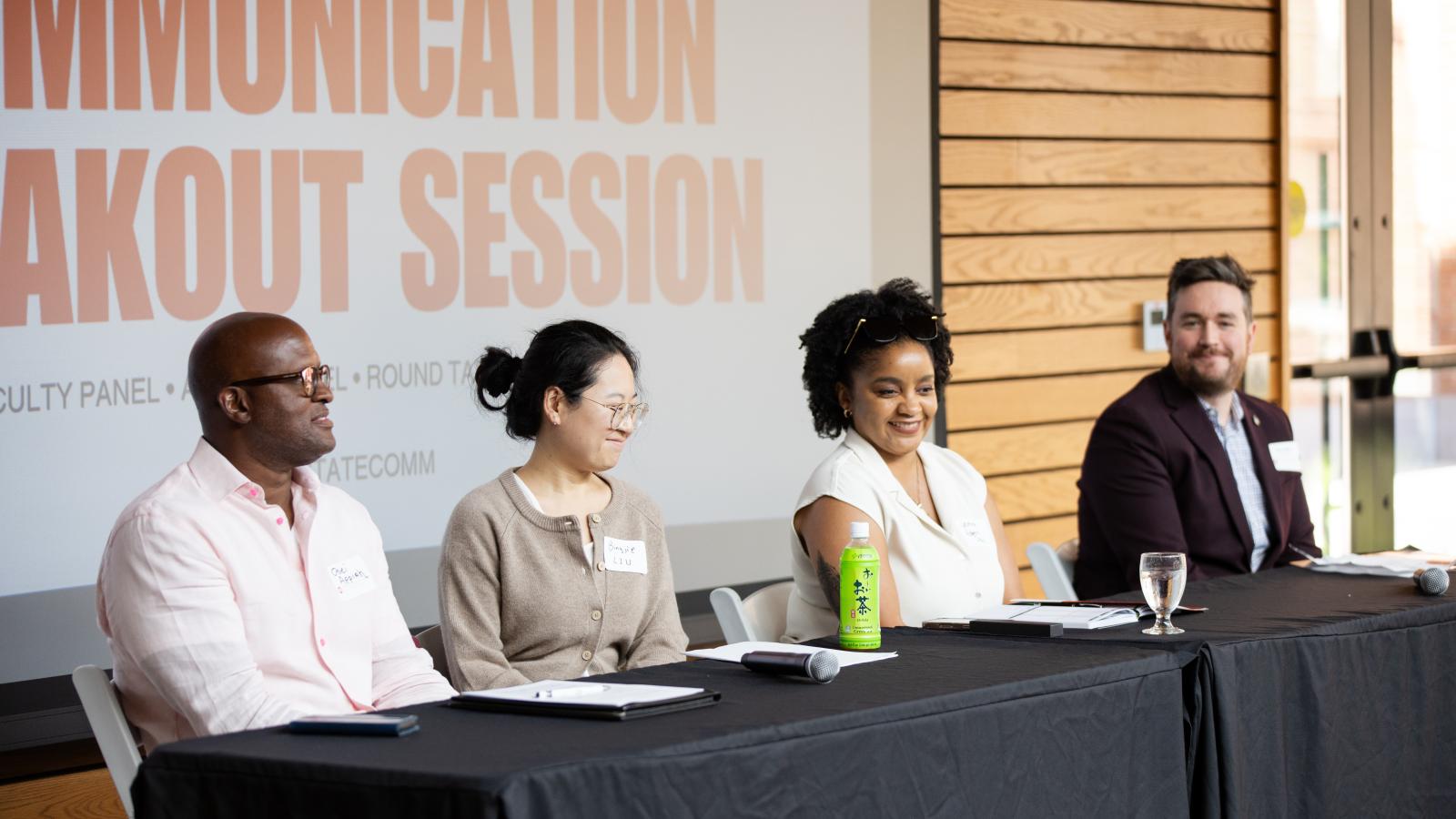 Faculty panel speaking at alumni reunion 