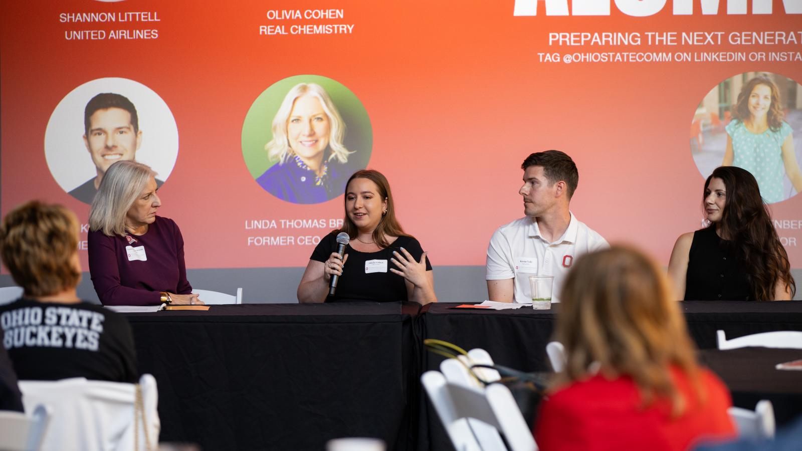 Alumni pannel speaking at reunion 