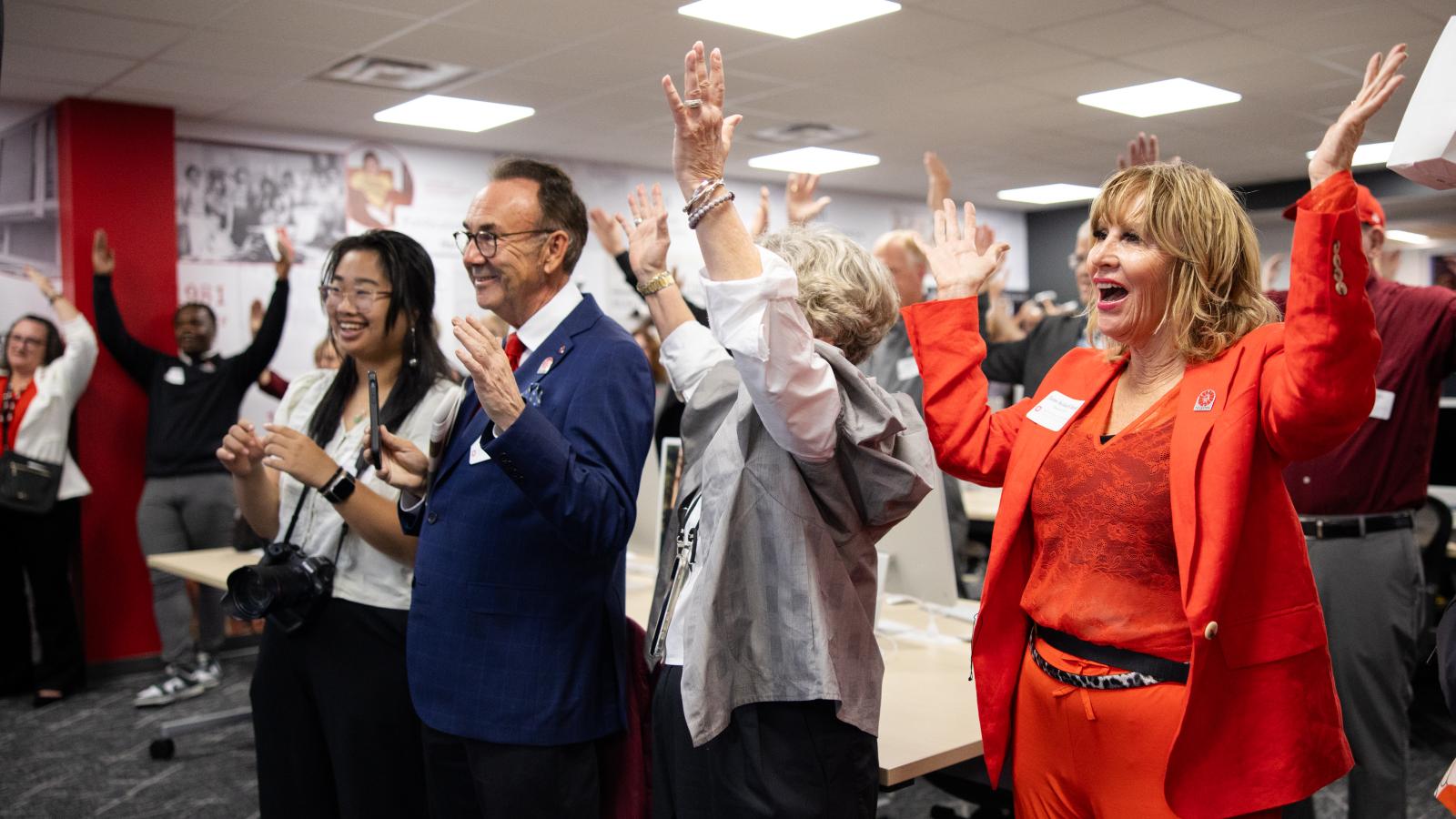 Participants sing carmen ohio
