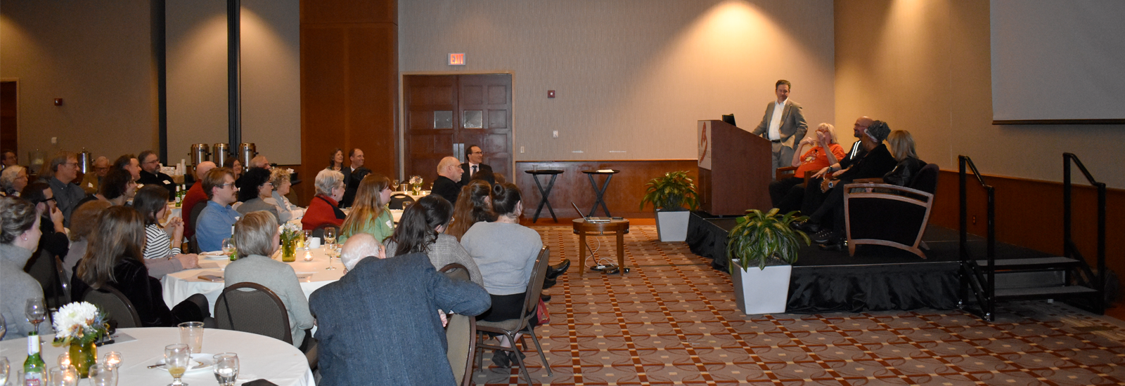 Guests and speaker at a dining hall for the Lantern reunion